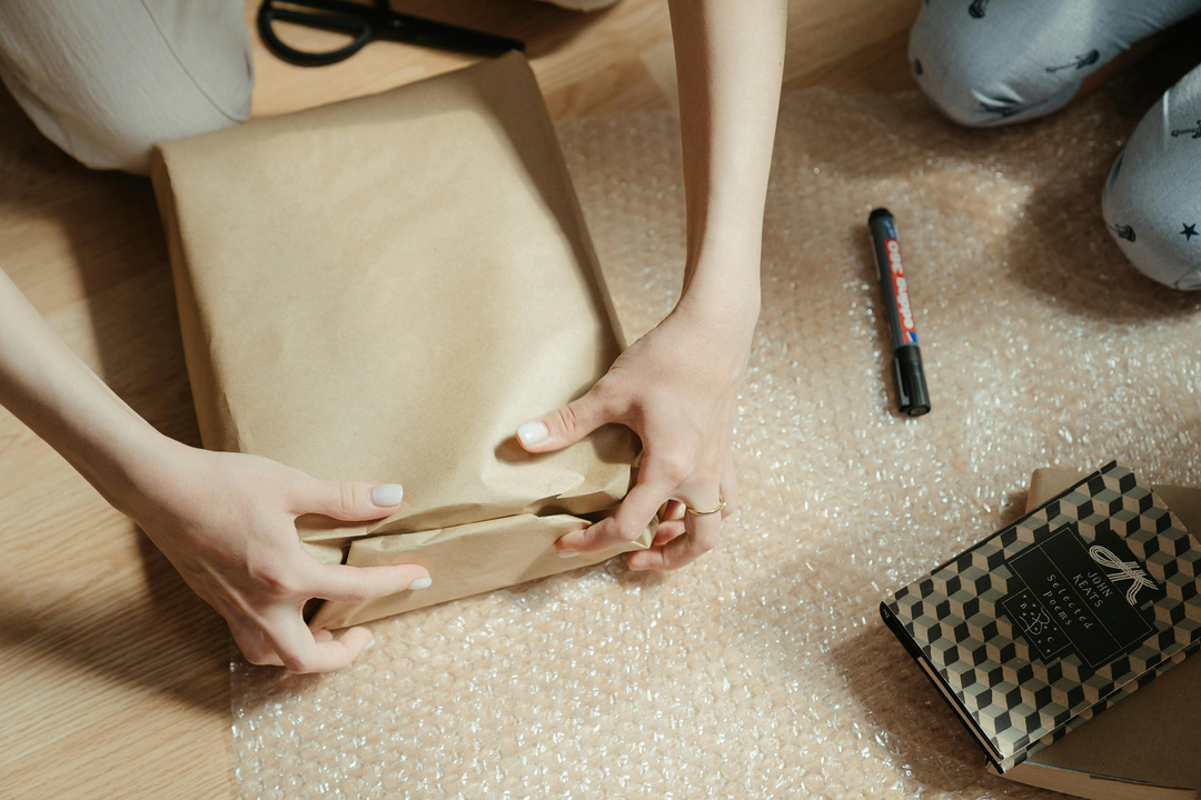Box being wrapped - custom packaging - gift box packaging