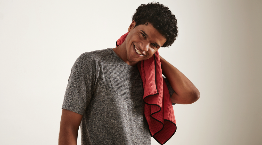 Man using red gym towel - gym towel - gym promotions