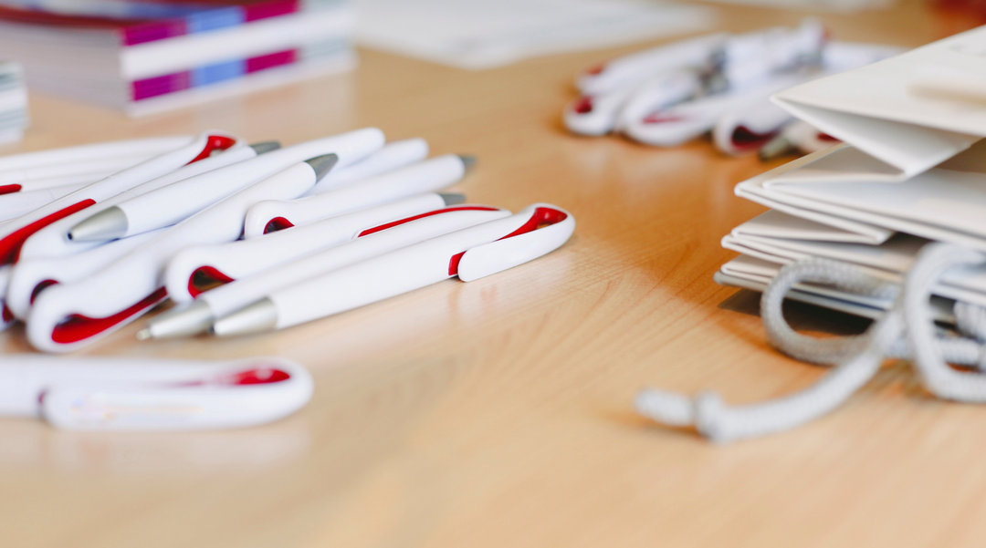 Pens and other promotional products on a table - how to use promotional products effectively - promotional products supplier