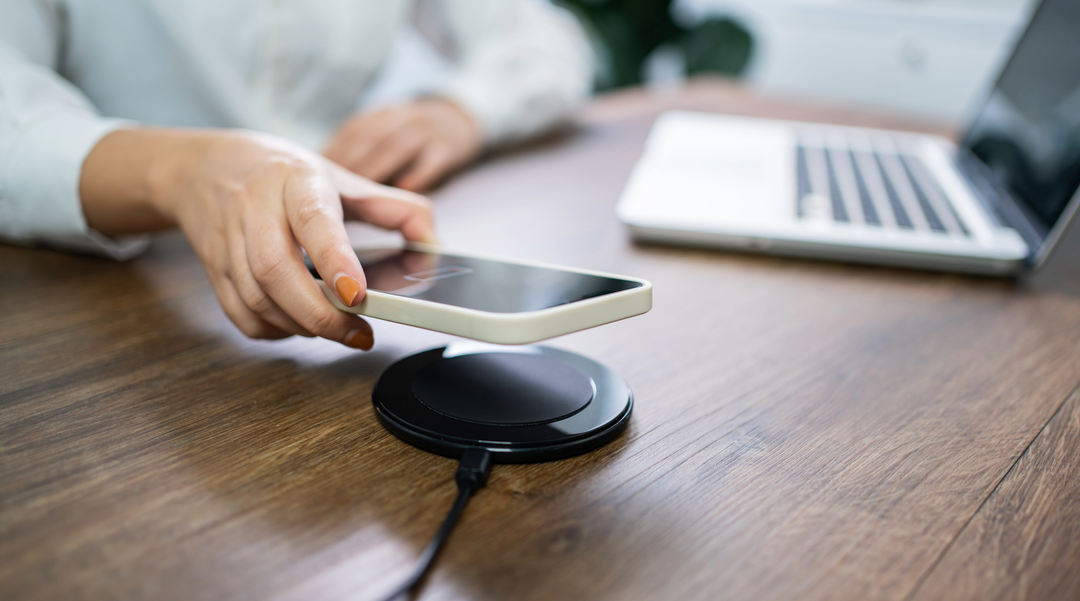 Phone being placed on wireless charger - wireless charger - corporate gifts