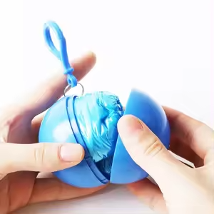 Someone opening poncho ball keyring - Poncho - promotional products supplier