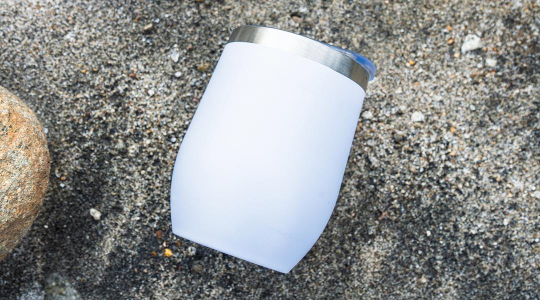 Tumbler cup lying on the ground - tumbler cups - corporate gifts