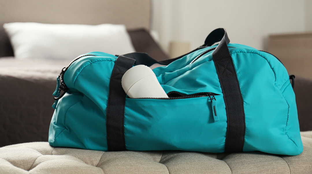 Weekend bag on bed - weekend bag - sports bag